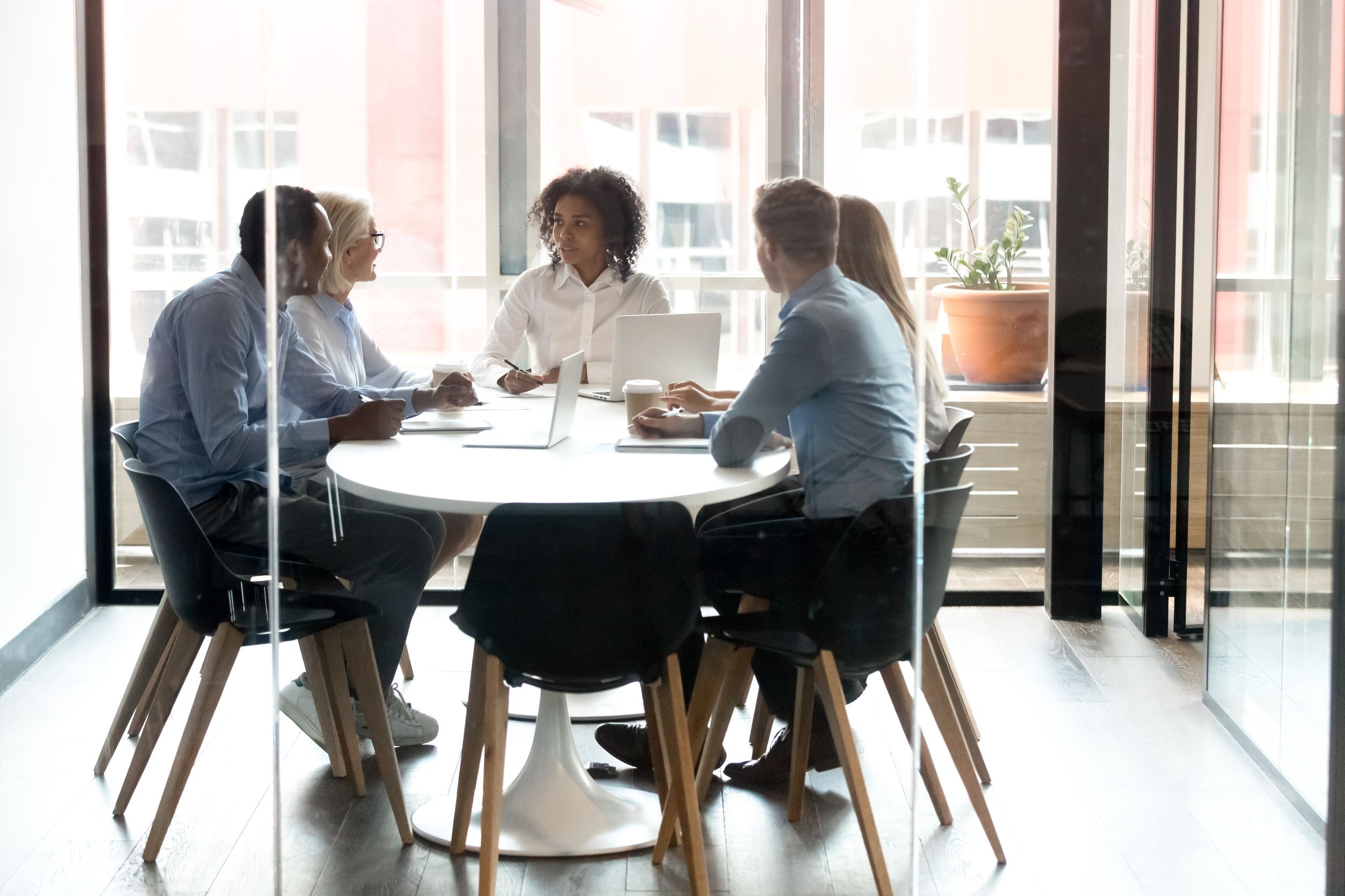 Business team meeting around conference table