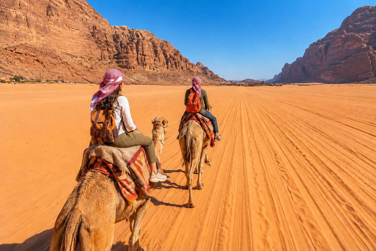 Tourists Riding Camels At Wadi Rum