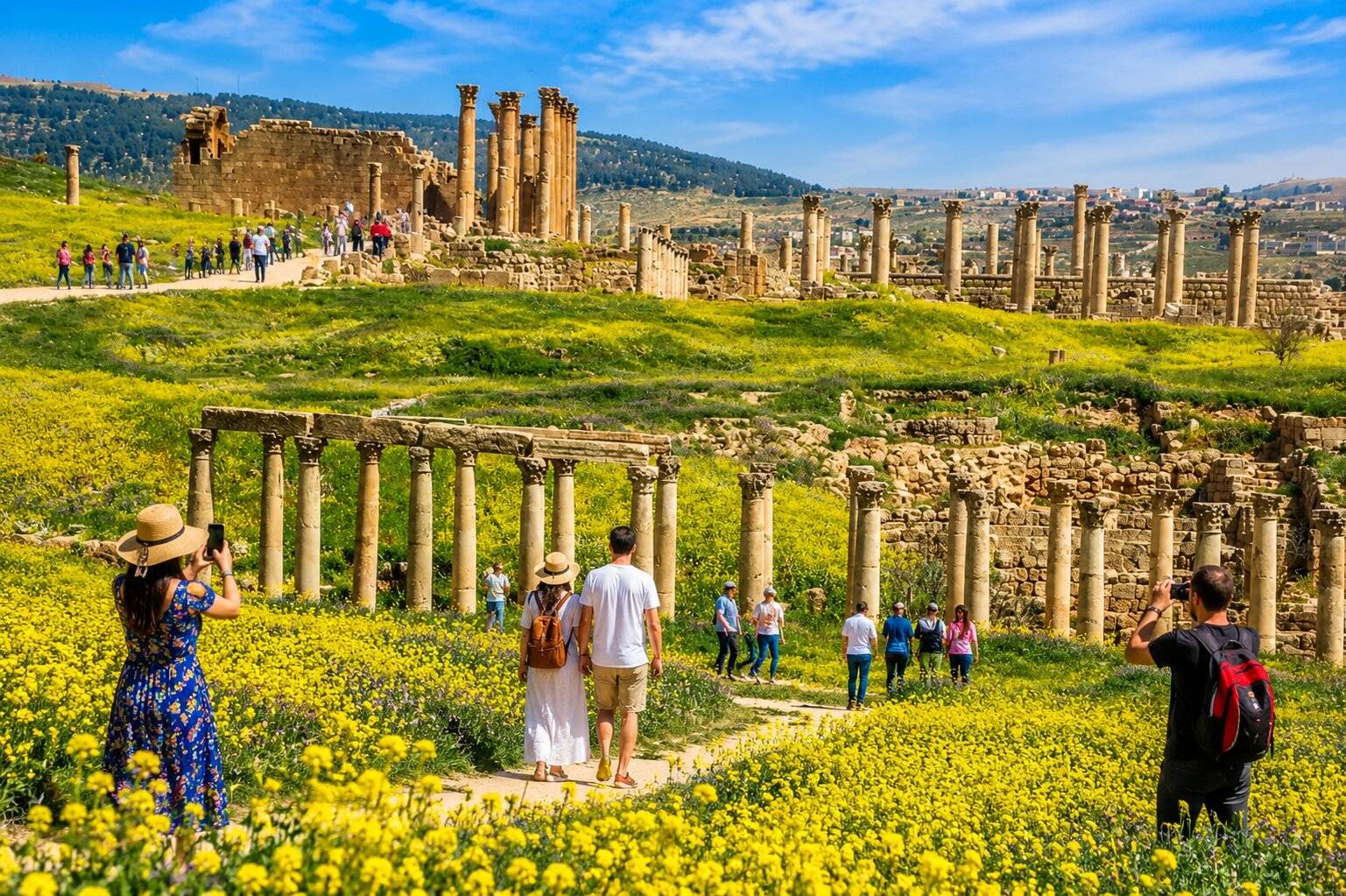 Visitors Exploring The Jerash Ruins In Spring